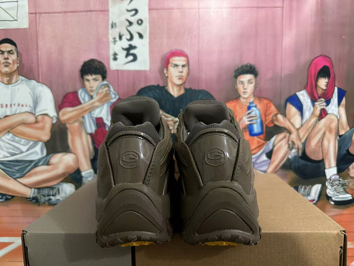 Rear view of brown E-Tek sneakers showing the heel details.
