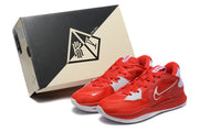 Red and white Nike Kyrie shoes beside a Kyrie Low 5 shoe box