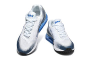 Pair of white Nike Air Max sneakers with blue dotted accents, blue heel units, and white laces.