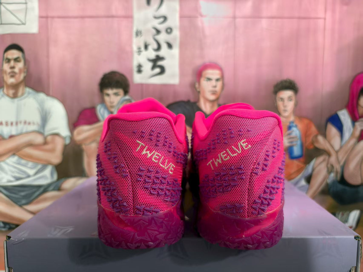 Rear view of bright pink Nike basketball sneakers showing textured heels, patterned uppers, and translucent outsoles.