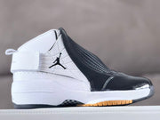 Side view of a white and black Jordan 19 high-top sneaker with an ankle strap and glossy black toe.