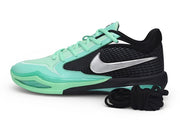 Side profile of a black Nike Sabrina 4 shoe with green accents