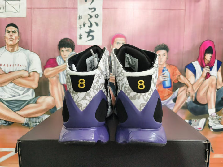 Rear view of black, gray camouflage, and purple high-top basketball shoes