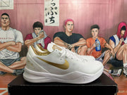 Side profile showing the gold Swoosh and heel detailing