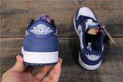 Rear view showing the navy heel, white midsole, and Jordan wings branding.