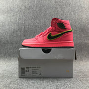 Side view of the sneaker above its box; the box label shows size 5.5, EU 36, style AQ9131 600 and color text including Hot Punch, Black and Volt.