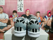 Rear view showing the heel graphics, grey collars, and white midsoles.