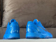 Rear and side views of blue Kobe 6 shoes with heel details.