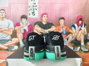 Rear view of the black basketball shoes showing GT heel lettering and silver heel details.