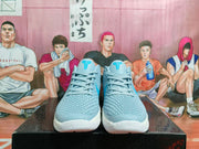 Front view showing the textured light blue uppers, laces and blue tongue logos.