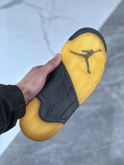 Underside view showing the gum-colored outsole, black center section, and Jordan branding.
