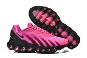 Pink and black Air Max DN 8 sneakers shown from the side and outsole.