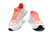 Front view of a pair of white and coral On Cloudtilt Remx sneakers.