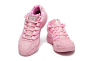 Top-front view of the pink Nike KD shoes showing the KD tongue logos and lace-up design.