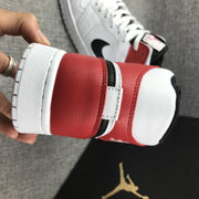 Close-up of the red heel and white collar with visible stitching and black trim.