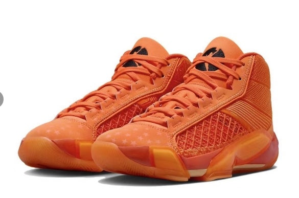 Orange high-top Jordan basketball shoes shown as a pair