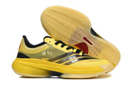 Side profile of a yellow basketball shoe with the patterned outsole visible