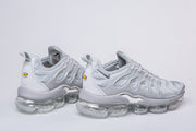Pair of silver-gray Nike TN-4 sneakers shown from the side