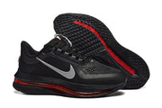 Black Nike Pegasus Premium shoes showing the side profile and patterned outsole.