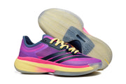 Side view of the purple and pink shoes with dark stripes, alongside a view of the patterned outsole.