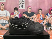 Side profile of a black Nike sneaker showing the outlined Swoosh, stitched upper panels and a black sole.
