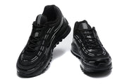 Two black lace-up sneakers shown from front angles.
