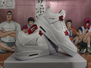 Angled view showing the white upper, red lace supports, mesh side panels, and midsole air windows