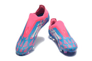 Top view of a pair of pink and blue laceless soccer cleats.