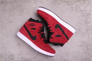 Side view of the pair showing the red high-top panels, black Swooshes, white midsoles, and dark outsoles.