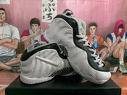 Angled view of the pair showing the high-top profile, padded tongue and sculpted side panels.