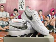 White Nike sneakers displayed at an angle, showing the patterned Swoosh and perforated upper