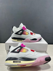 Close angled view of the sneakers highlighting perforated gradient panels, pink accents, and the outsole.