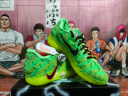 Pair of green Nike sneakers shown from angled side and front views, highlighting the patterned uppers, dark laces, and bright outsole.