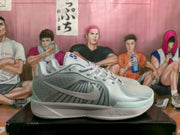 Side profile highlighting the Nike Swoosh, mesh-like upper panels, low-cut collar, and white midsole.