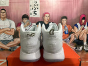 Rear view of white Nike basketball shoes with silver details