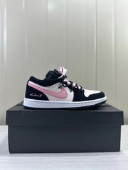Side profile of a black, pale pink, and white low-top sneaker