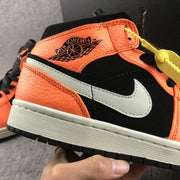 Close-up of the collar branding, textured orange panels, stitching, and light-colored Swoosh.