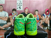 Rear view showing green textured heels with red TWELVE embroidery and neon outsoles.