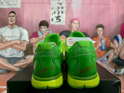 Rear view of the green Nike KD basketball sneakers showing the heel overlays, Nike details, and lime-green sole sections.