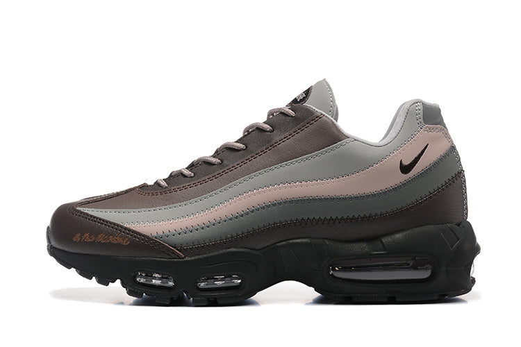 Side view of layered grey, brown, and muted pink Nike Air Max 95 sneakers
