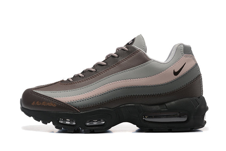 Side view of layered grey, brown, and muted pink Nike Air Max 95 sneakers
