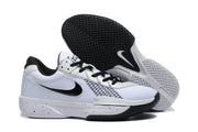 Nike Academy sneakers displayed with one shoe tilted to show the black patterned outsole.