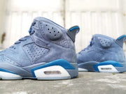 Side view highlighting the perforated collar, blue accents, and visible heel cushioning element.