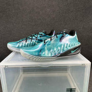 Pair of iridescent blue-purple basketball shoes with black laces and pale outsoles