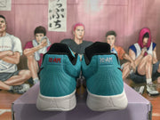 Rear view of teal sneakers showing stitched heel panels, black collars, white midsoles, and Jordan branding.