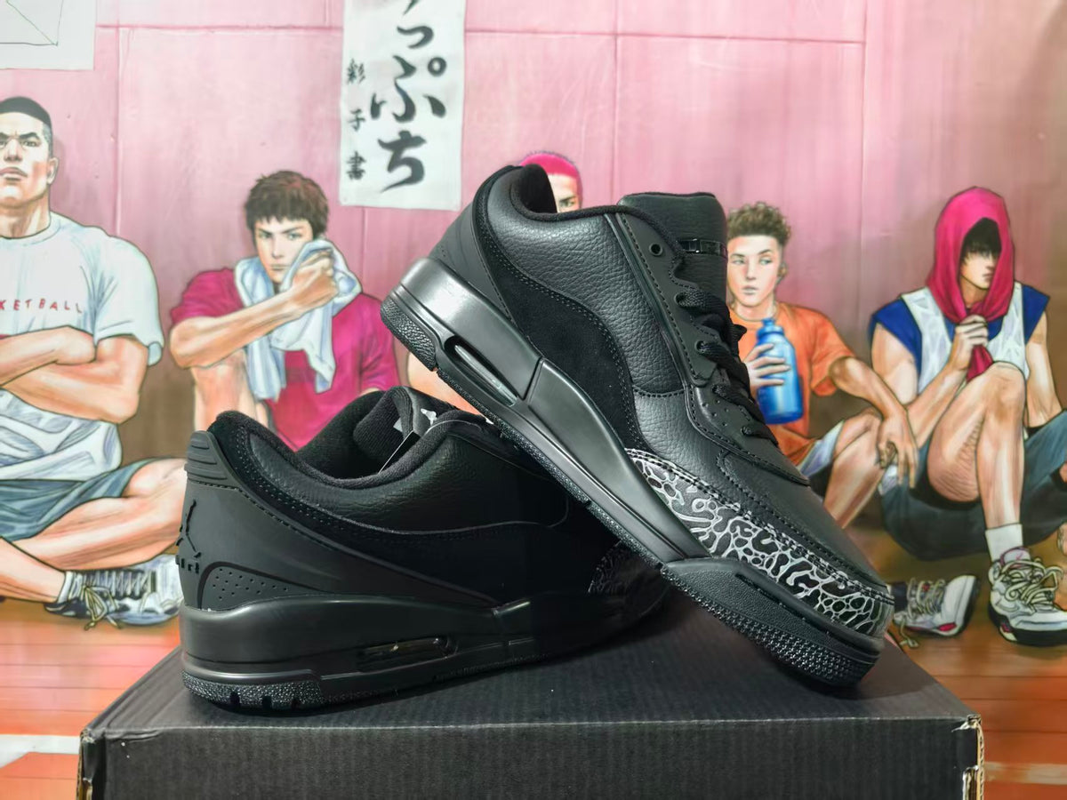 Black low-top sneakers displayed at an angle, showing the patterned toe overlay and heel Air unit.
