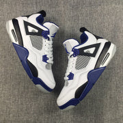 Pair of white, black, and blue high-top sneakers arranged diagonally on a gray background.