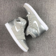 Top-down view of the pair showing the perforated toe boxes, silver Swoosh details and white midsoles.
