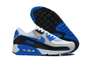 Nike Air Max 90 sneakers shown from the side and outsole, highlighting the visible Air unit and patterned tread.