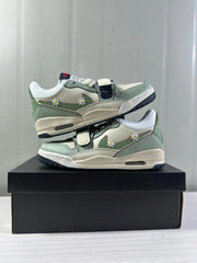 Stacked view of the low-top sneakers showing both side profiles and their mint green color blocking.